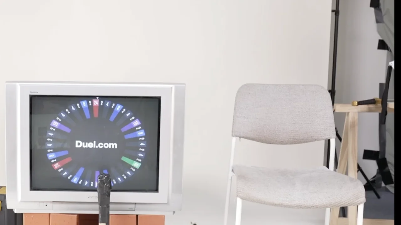 Duel Castle Roulette live — the multiplier wheel on screen on a chaotic studio set